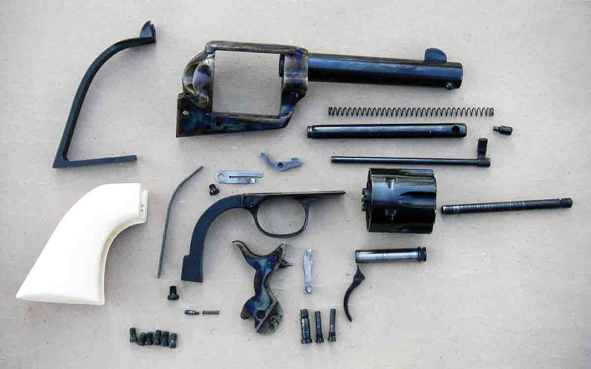 The Great Western II by Pietta disassembled. It is a Colt SAA pattern revolver but features a coil hand spring.